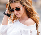 girl wearing croakies fashion sunglass strap athens gold