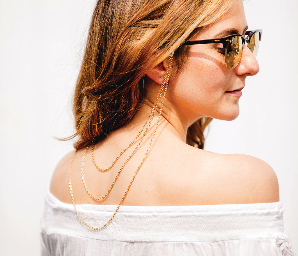 Women wearing Croakies Triple Layer Gold Sunglass Strap