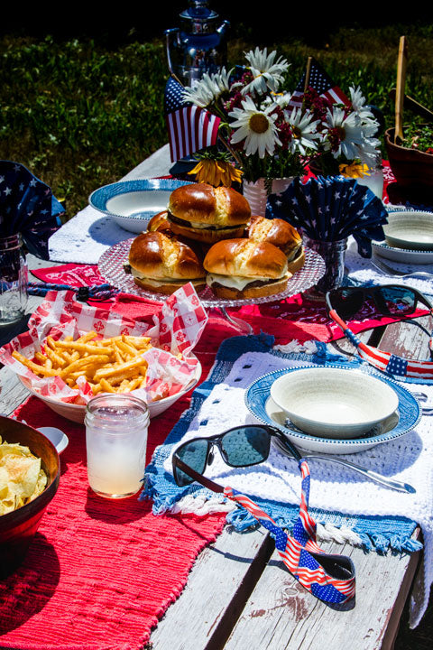 US flag Croakies on a table with a Summer picnic
